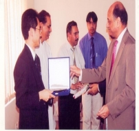 Mr. Shahab Khwaja presenting a shield to Assistant of SG